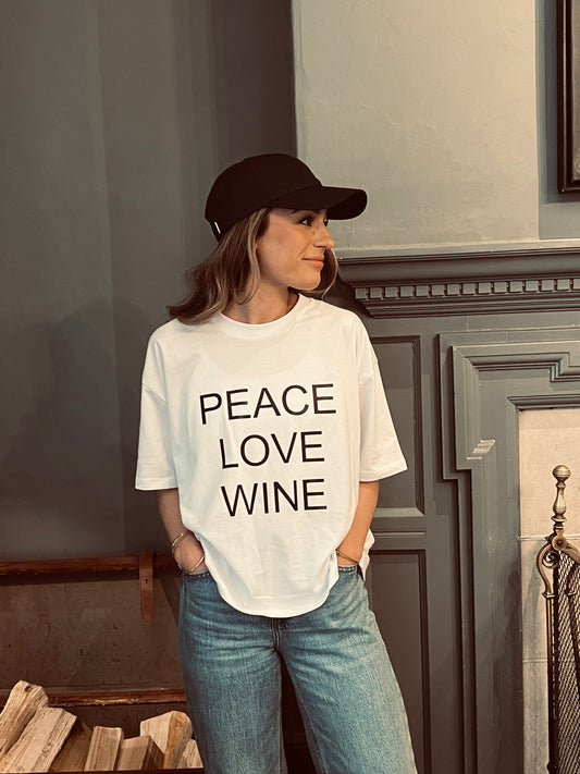 New In Peace Love Wine Slogan Boxy White Fit Organic Cotton Tee with a Black font.